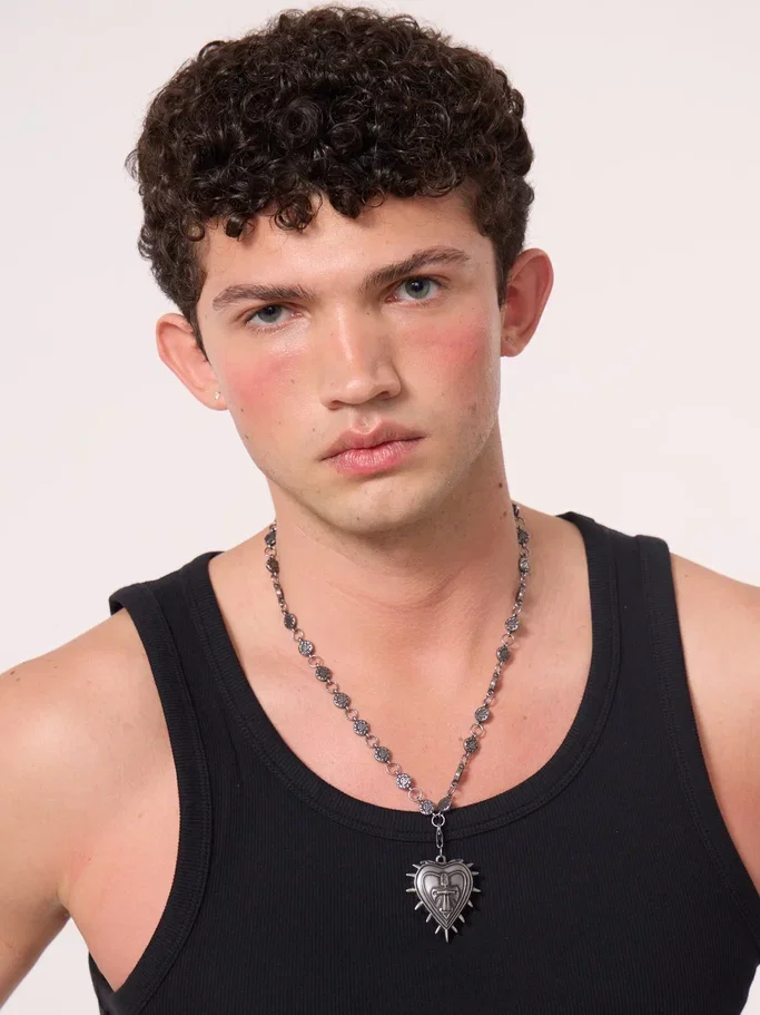 Model wearing the necklace over a black top